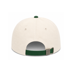 Back view of a structured baseball cap in off-white canvas with a dark green button, visor trim, and adjustable strap, shown on a plain white background.