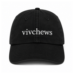 A black cotton baseball cap with the word 'vivchews' embroidered in white lowercase letters across the front, shown against a plain white background.