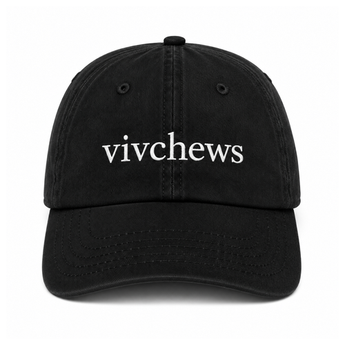 A black cotton baseball cap with the word 'vivchews' embroidered in white lowercase letters across the front, shown against a plain white background.